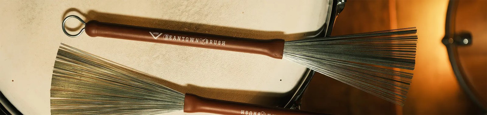 Vater wire brushes resting on a snare drum
