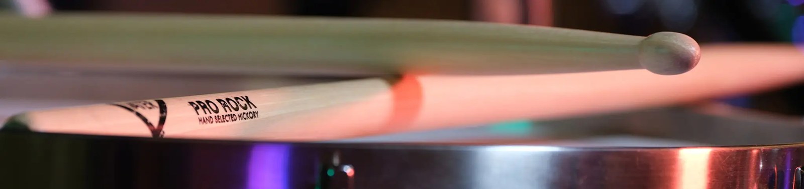 Vater American Hickory drumsticks resting on a snare drum